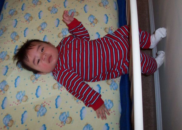 BenLegsThroughCrib (45K)